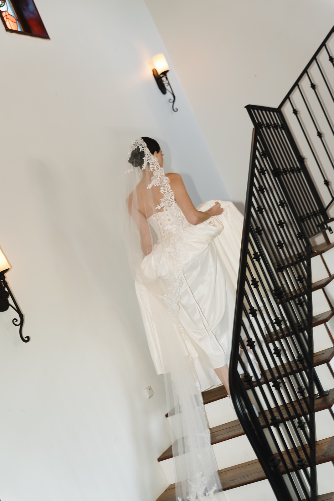 Bride on stairs at Jeune Perche Estate wedding