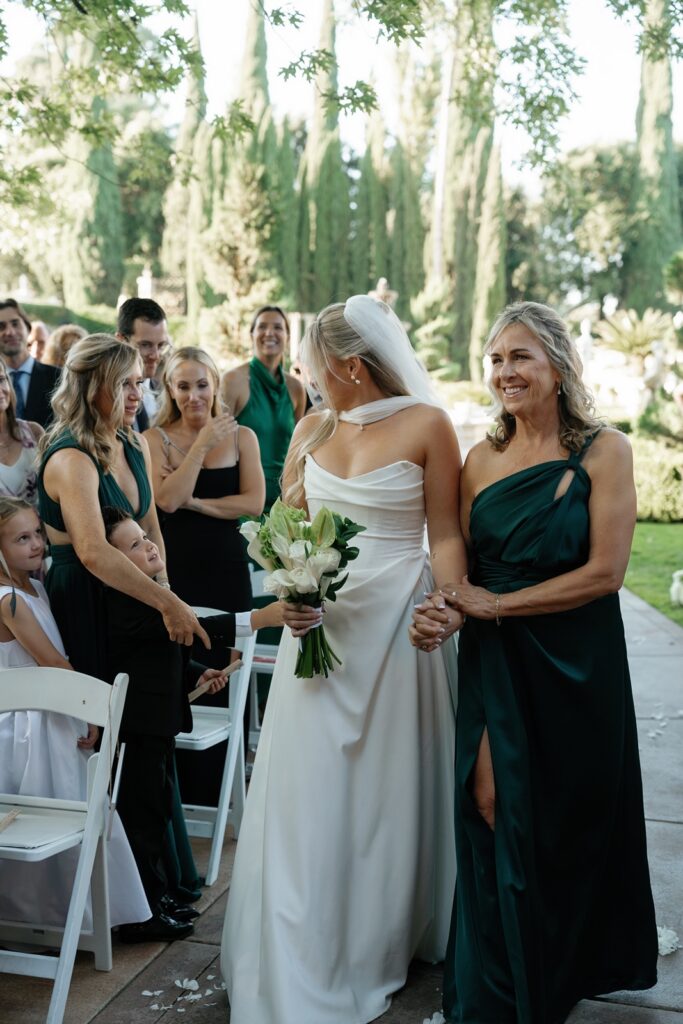 Bride walks down aisle at Grand Island Mansion wedding ceremony