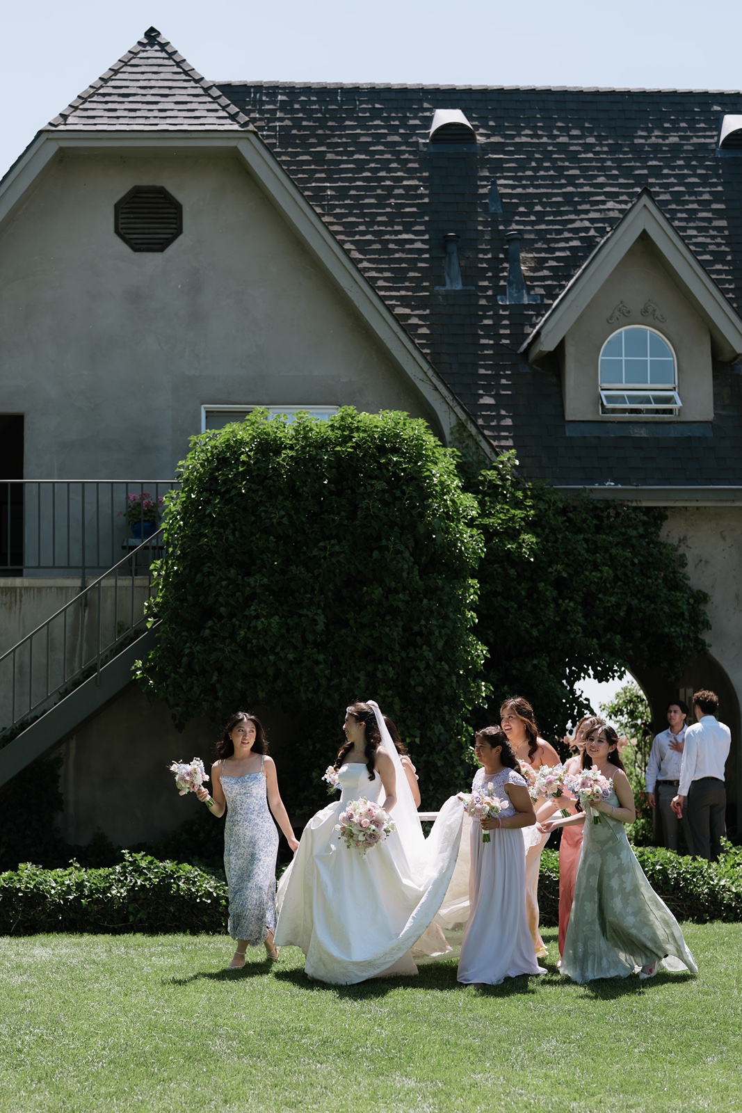 Bridesmaids in pastel colored gowns at the Cavaignac Estate wedding