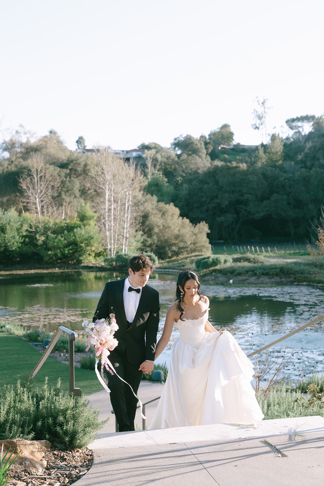 Bride and groom walking together at Monserate Winery