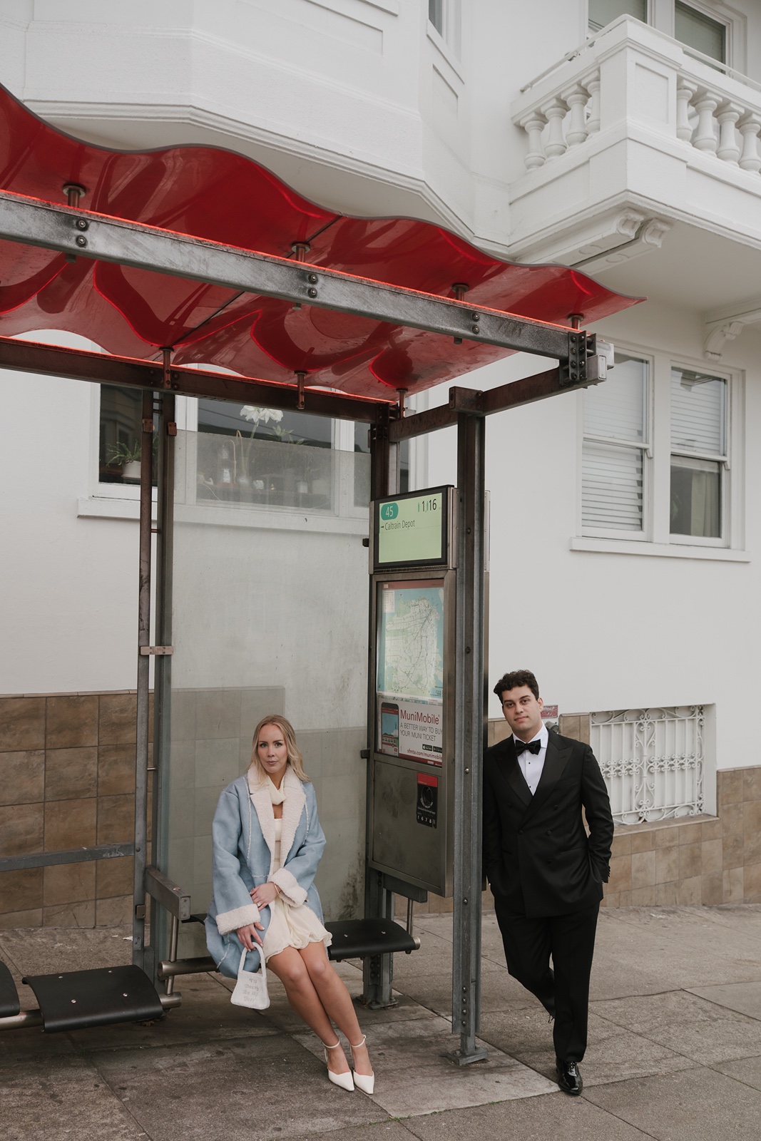 Couple waits on bus in San Francisco