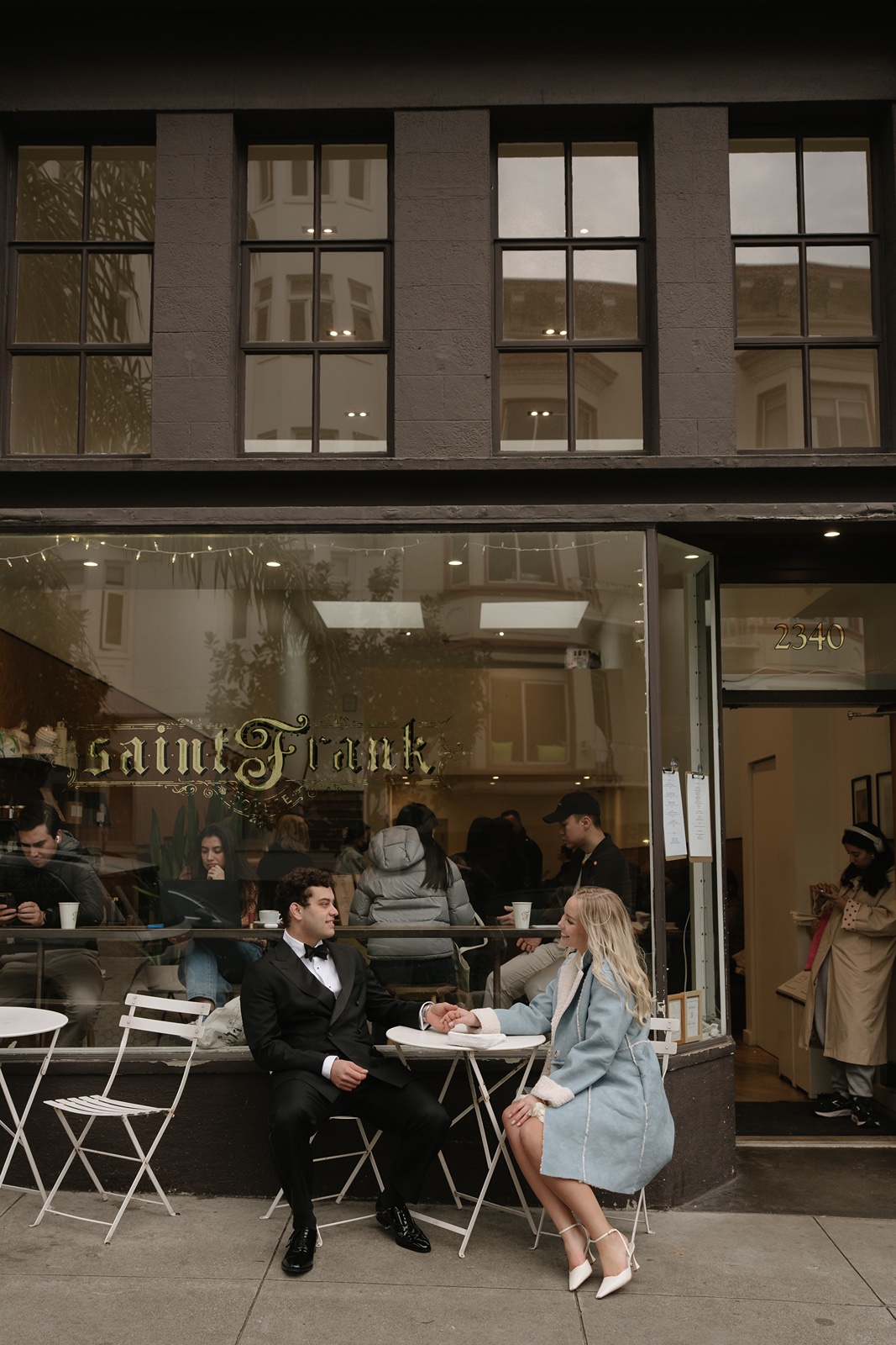 Couple at a coffee shop for San Francisco engagement photos