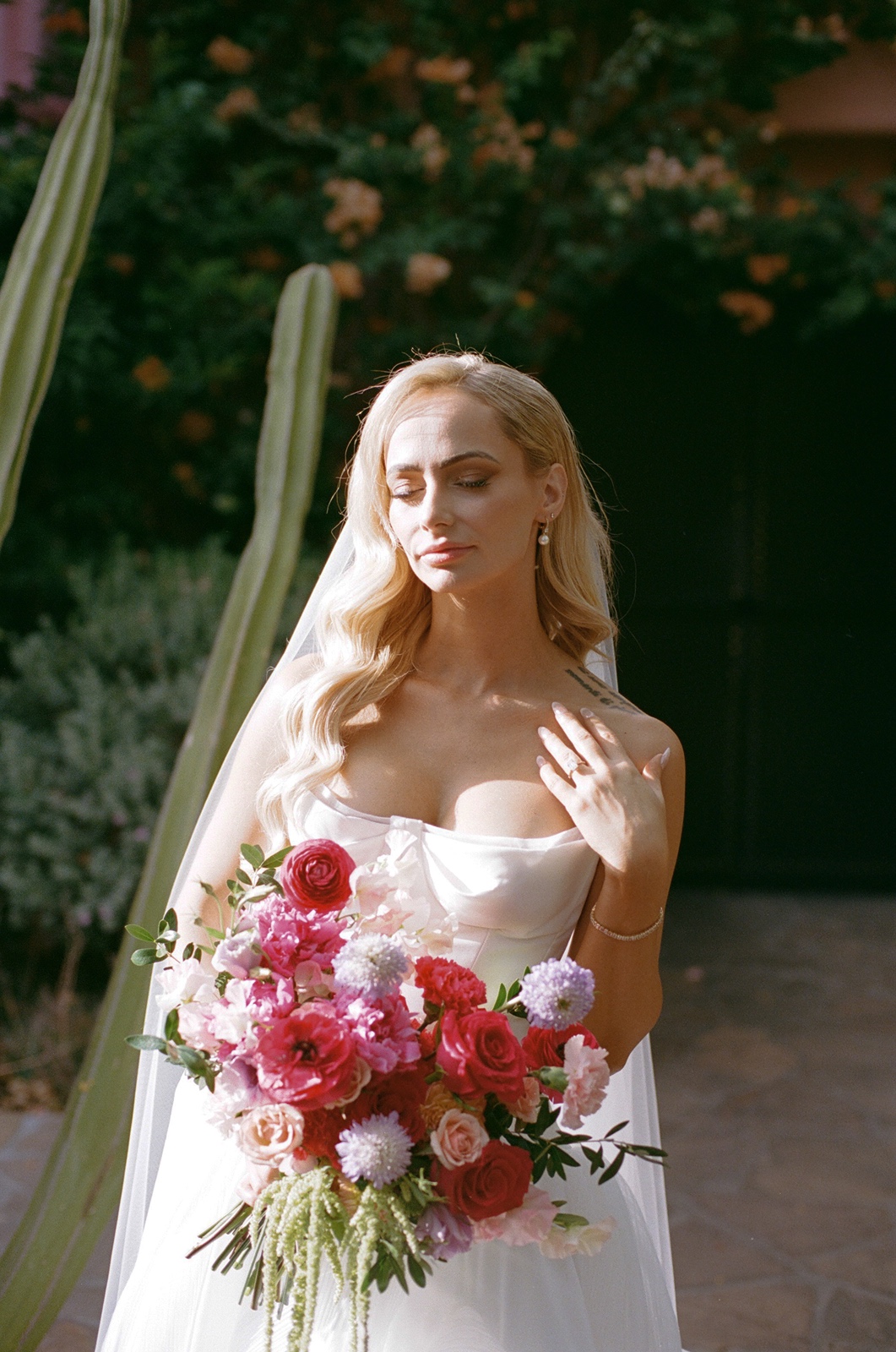 Bride with bright colored bouquet at the Sands Hotel and Spa wedding