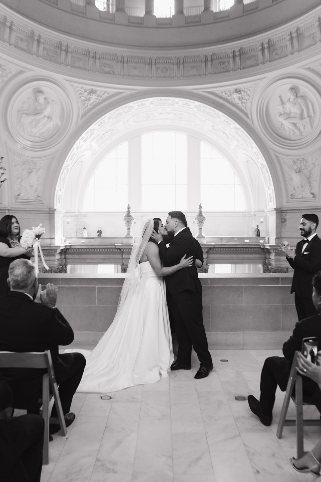 Bride and groom kiss at San Francisco City Hall wedding