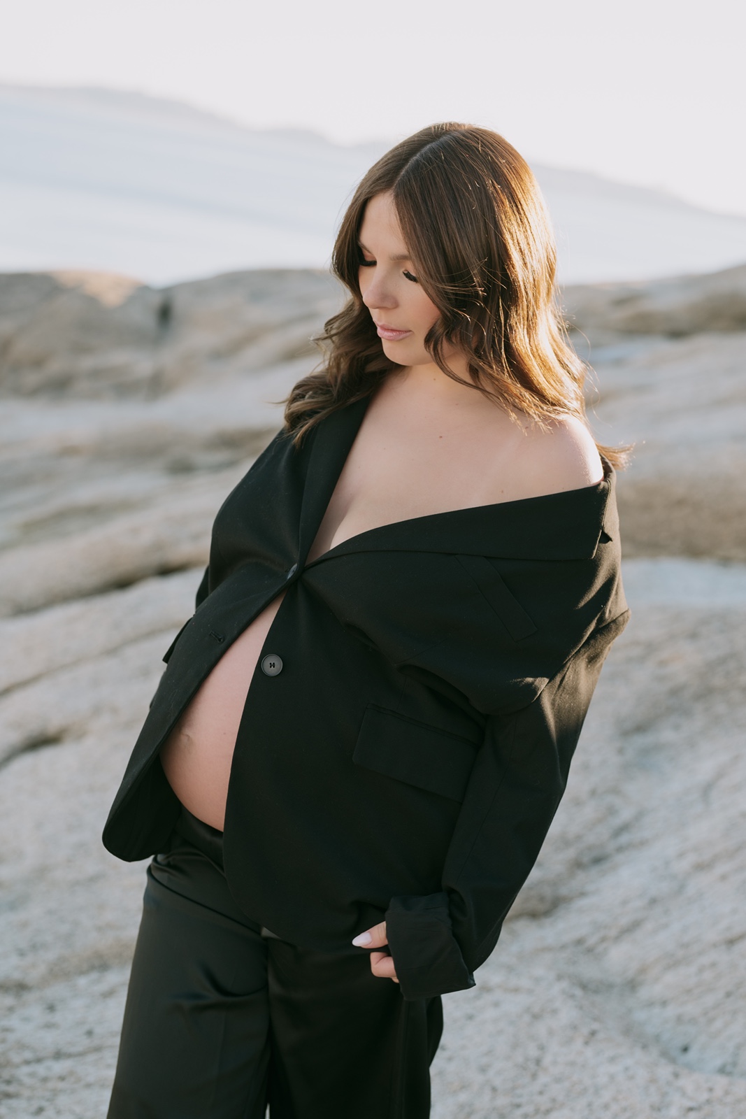 Woman in black shirt at maternity photos in Sacramento