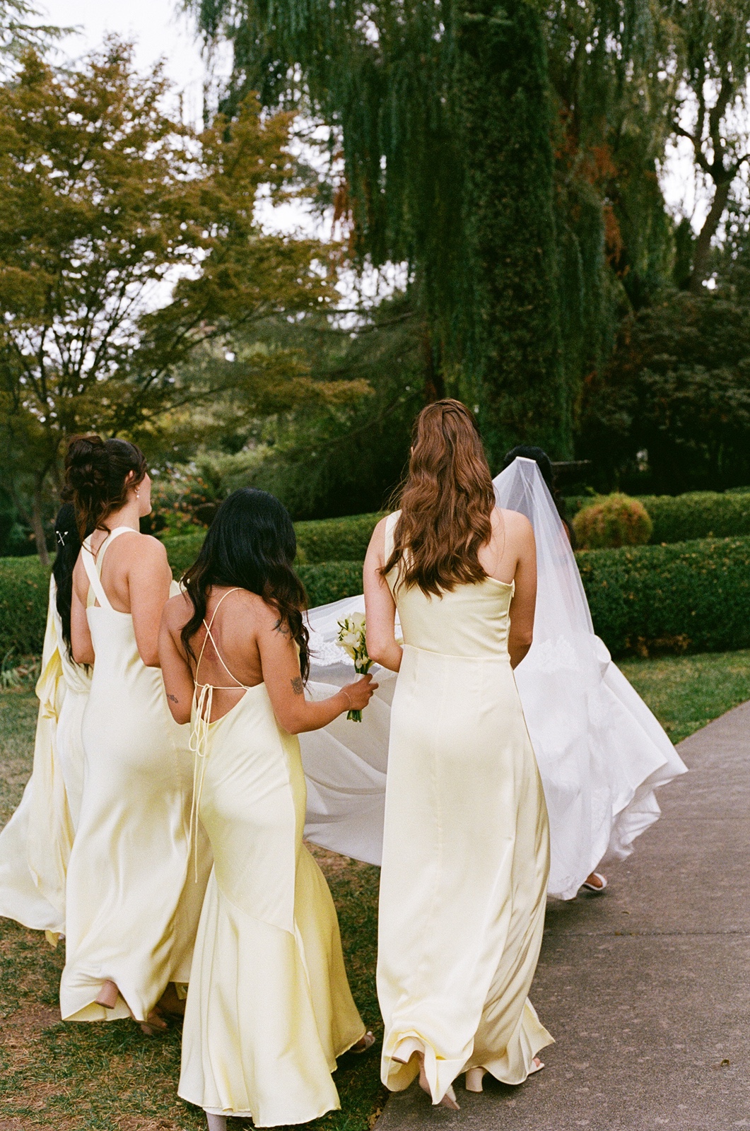 Bride with her bridesmaids in yellow dresses at the destination wedding