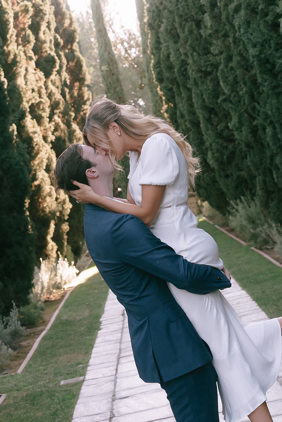 Man lifts and kisses woman during Los Angeles engagement session