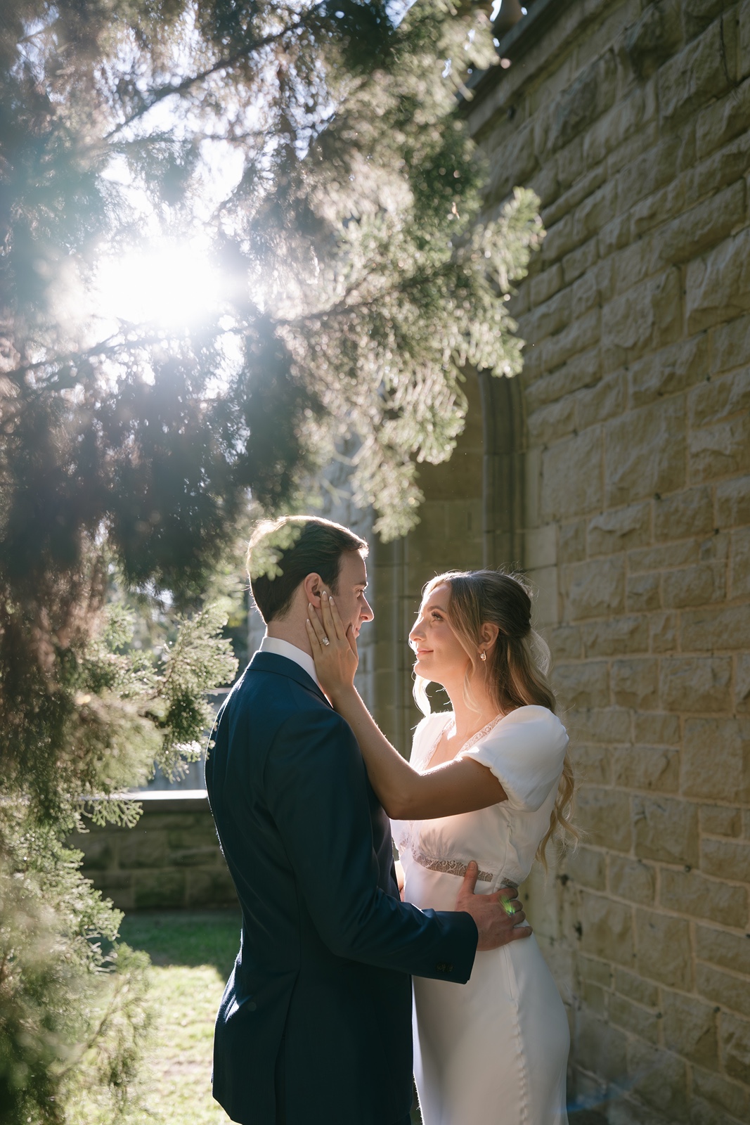 Woman touches man's face during Los Angeles engagement photos