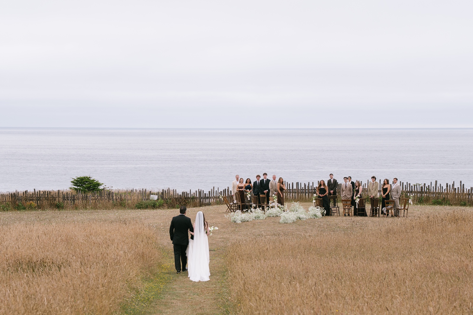 Bride walks down the aisle at her Switzer Farm wedding ceremony