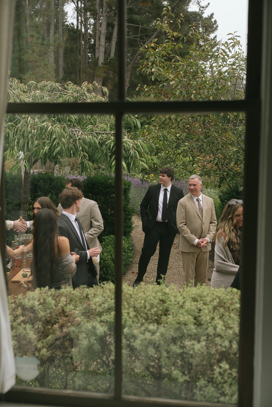 Guests mingle outdoors during Switzer Farm wedding cocktail hour