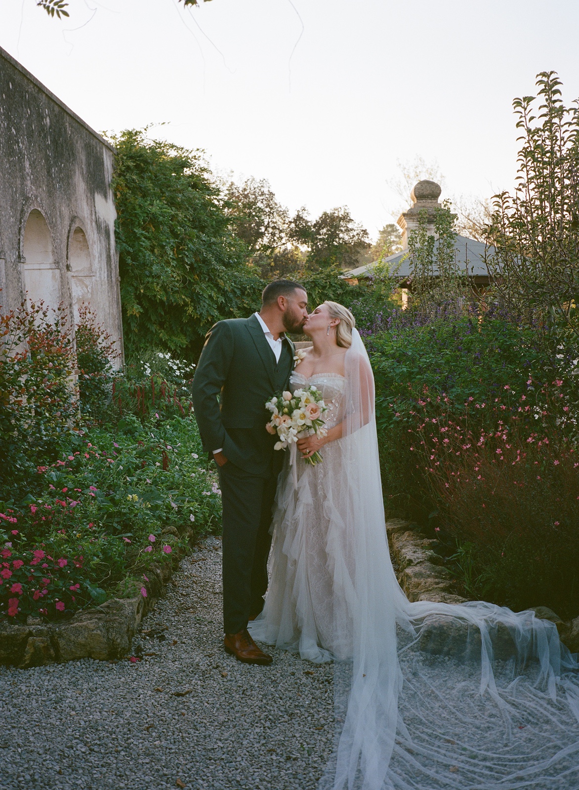 Bride and groom kiss at their destination wedding in Portugal