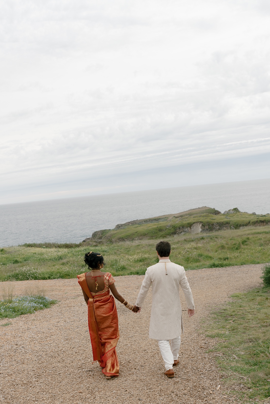 Couple holding hands during their wedding weekend